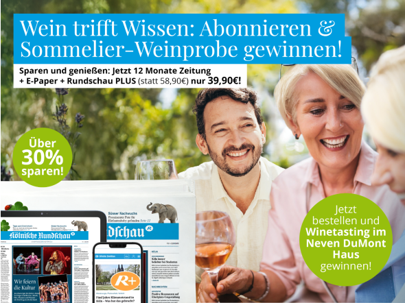 Menschen die gemeinsam an einem Tisch sitzen und Wein trinken und das KR Zeitung